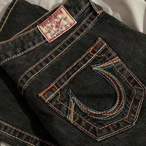 Faded black boot cut jeans.